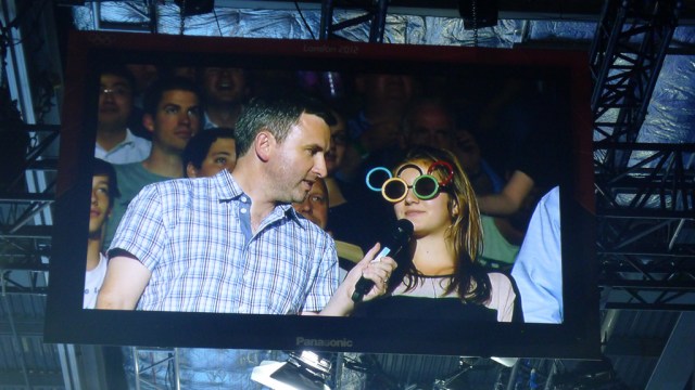 Man interviewing fan in comedy glasses
